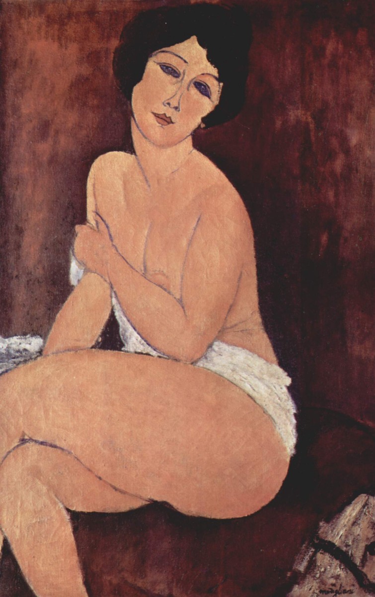 Nude seating on a sofa by Amedeo Modigliani