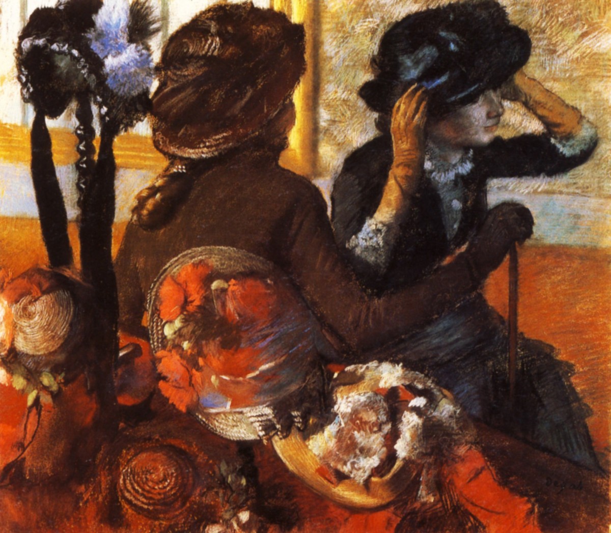 At the Milliner's by Edgar Degas