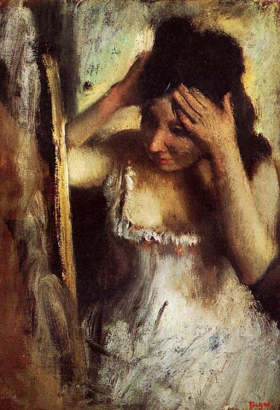 Woman Combing Her Hair in front of a Mirror by Edgar Degas