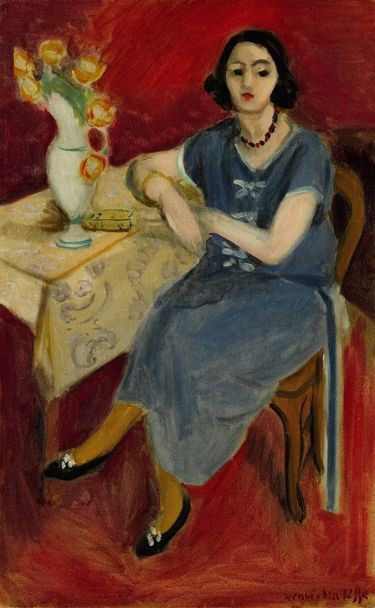 Woman in Blue at a Table, Red Background by Henri Matisse
